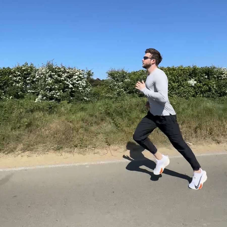 Chris running along a country road